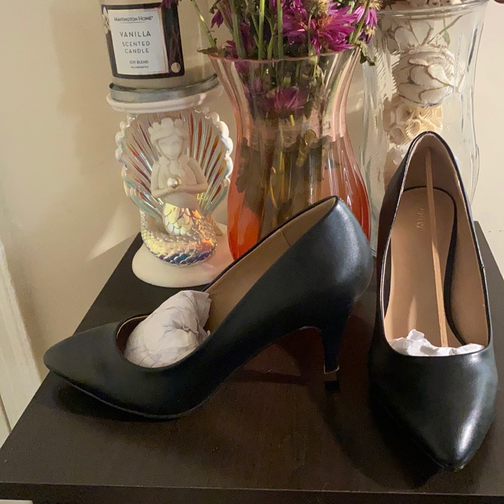 Never worn, 2 inch black heel.